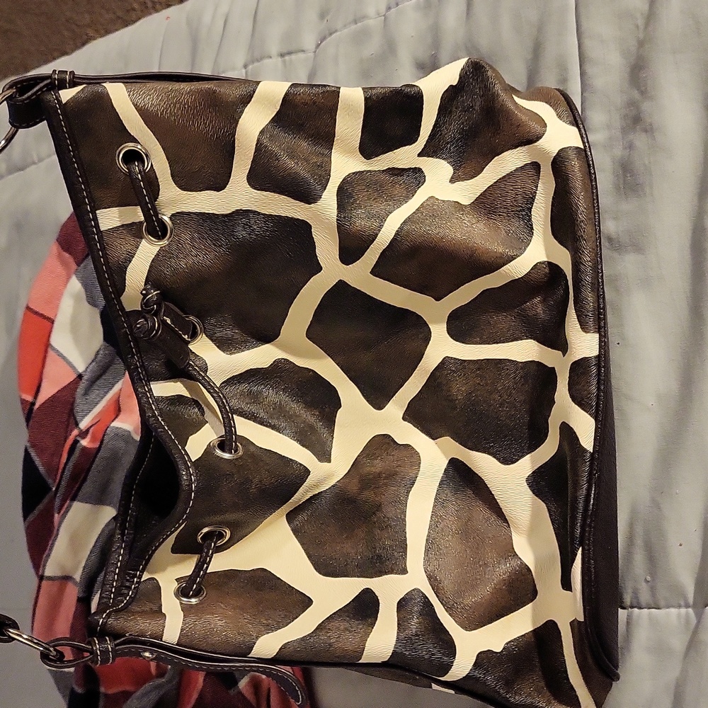 Black and white print leather bag. Nearly new now tears or worn spots.